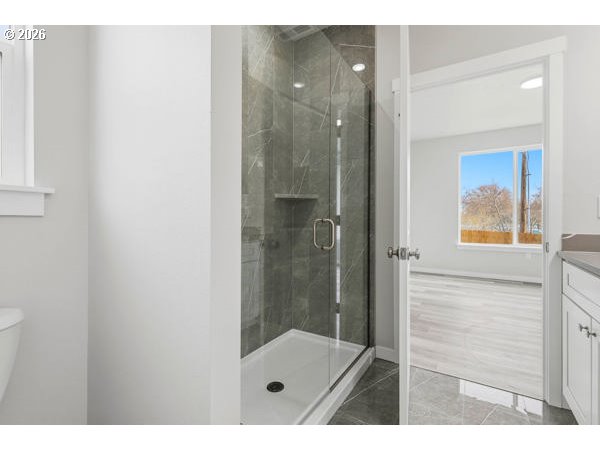1758 Northeast 9th Street Hermiston, OR 97838 - Photo 17 of 23 a bathroom with a glass shower door