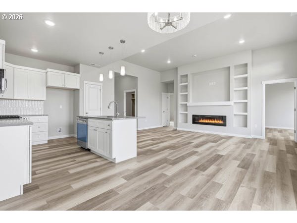 1758 Northeast 9th Street Hermiston, OR 97838 - Photo 7 of 23 a view of kitchen with cabinets and wooden floor