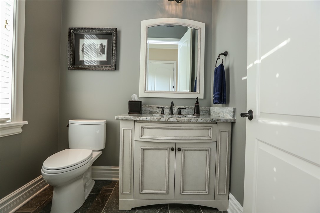 160 Goshawk Drive Victor, NY 14564 - Photo 17 of 50 A WELL-PLACED POWDER ROOM OFF THE BACK HALL.