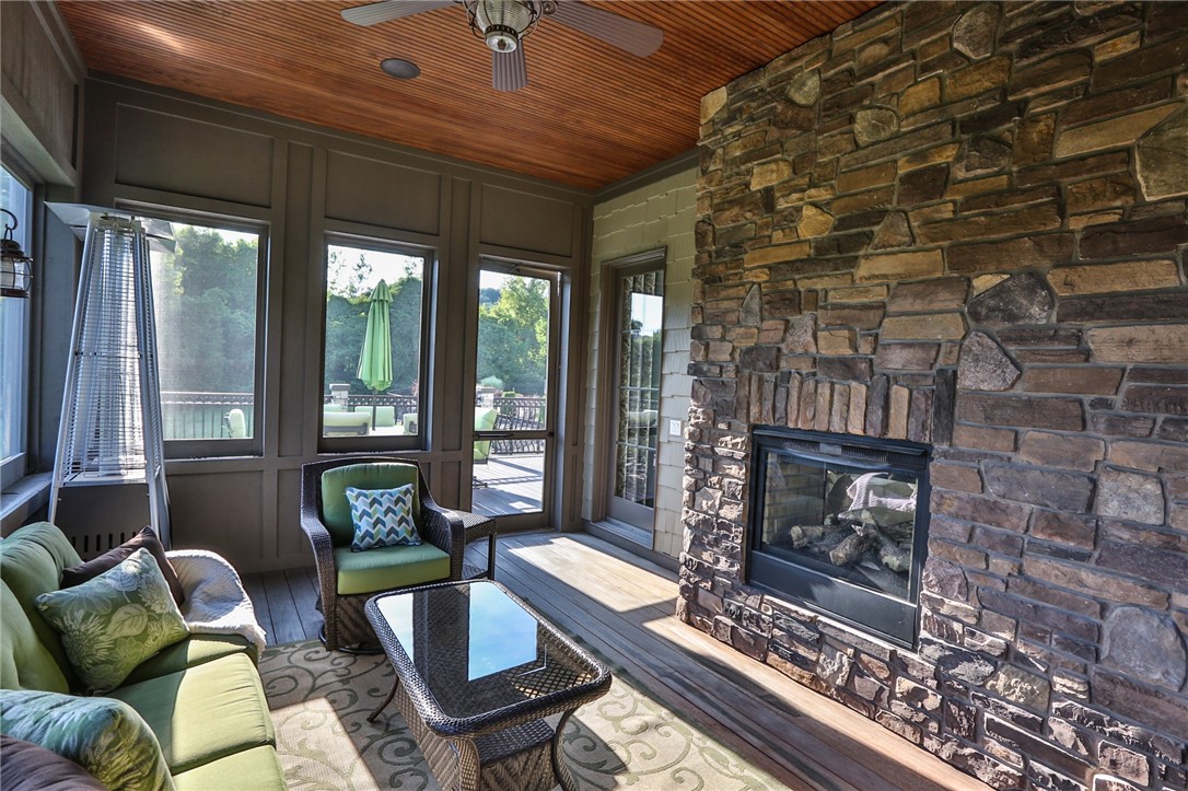 160 Goshawk Drive Victor, NY 14564 - Photo 9 of 50 INVITING SCREENED PORCH WITH 2-SIDED GAS FIREPLACE