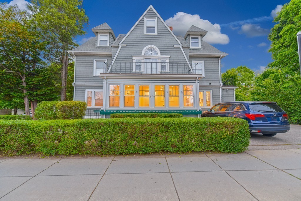 232 Aspinwall Avenue, Unit 1 Brookline, MA 02445 - Photo 2 of 13 a front view of a house with a garden