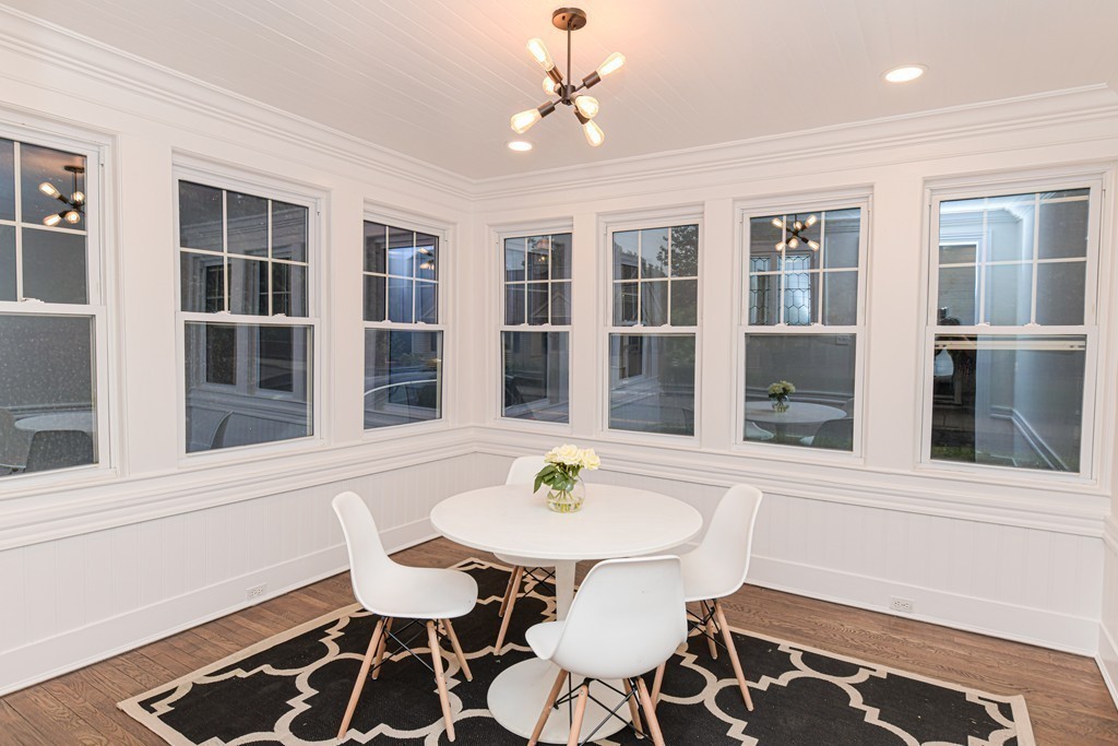 232 Aspinwall Avenue, Unit 1 Brookline, MA 02445 - Photo 6 of 13 a workspace with furniture window and wooden floor