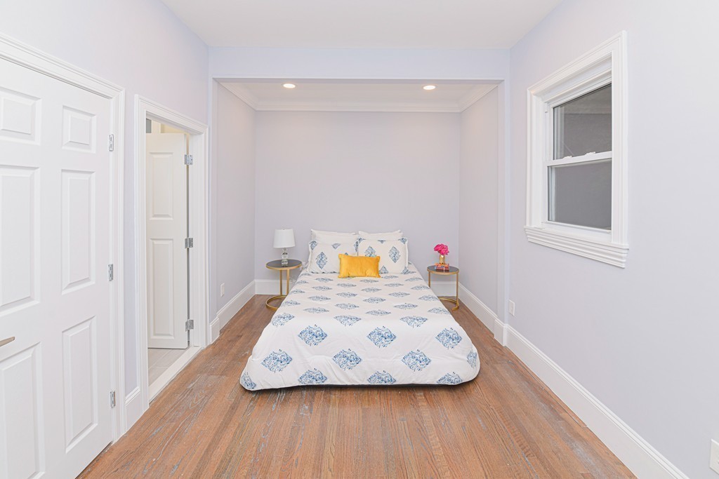 232 Aspinwall Avenue, Unit 1 Brookline, MA 02445 - Photo 8 of 13 a view of table and chair in room