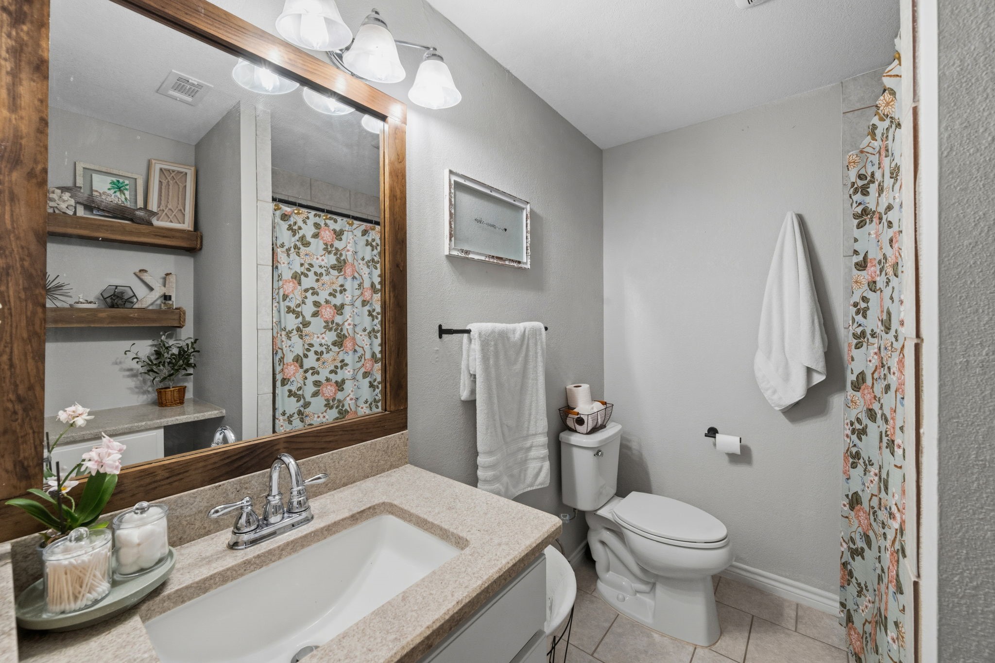 431 Corydon Drive Houston, TX 77336 - Photo 22 of 26 Thoughtfully updated bathroom featuring a stylish vanity, framed mirror, and updated vanity lighting. Clean lines and neutral finishes create a fresh, comfortable space.