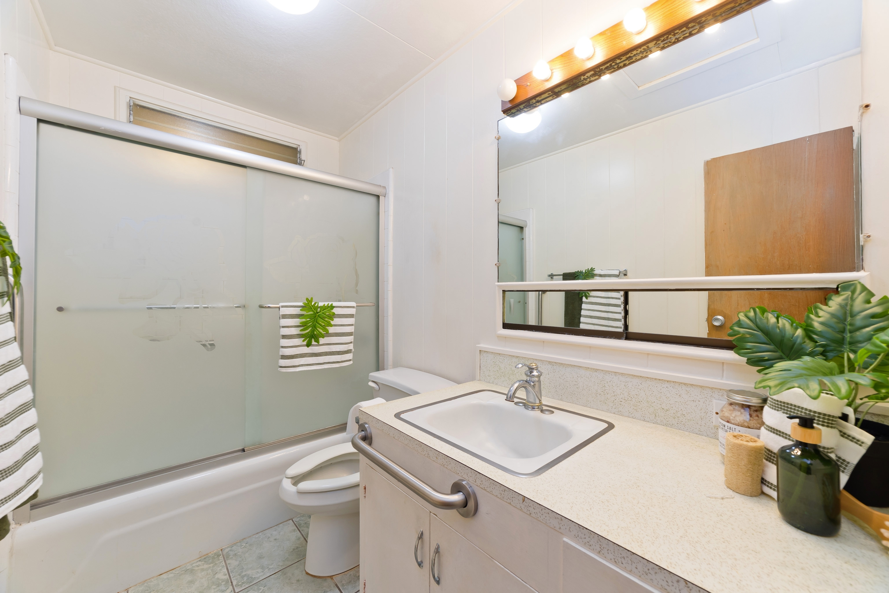 25 Wawai Loop Hilo, HI 96720 - Photo 11 of 22 a bathroom with a sink a toilet and shower