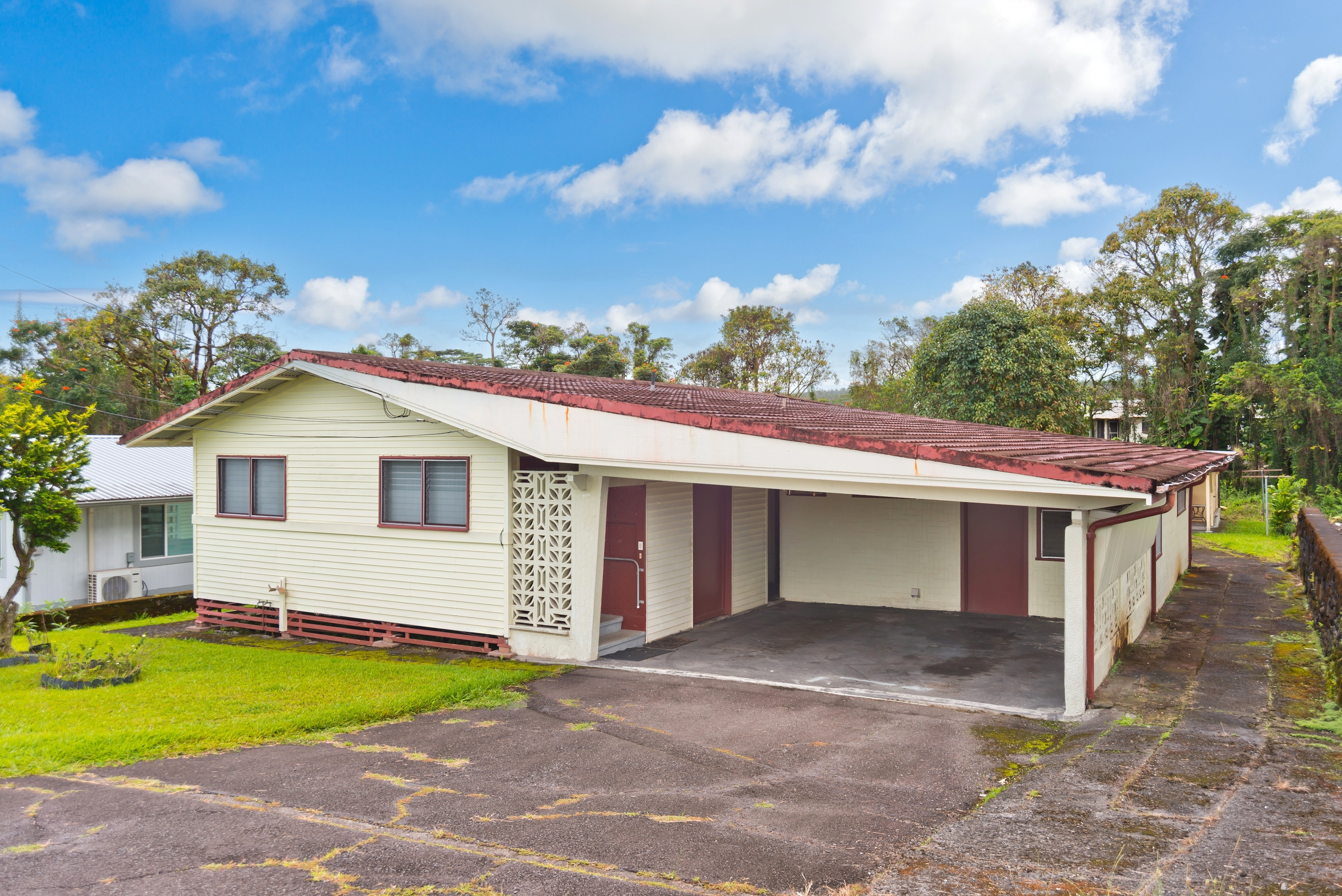 25 Wawai Loop Hilo, HI 96720 - Photo 21 of 22 a view of a white house with a yard and large tree