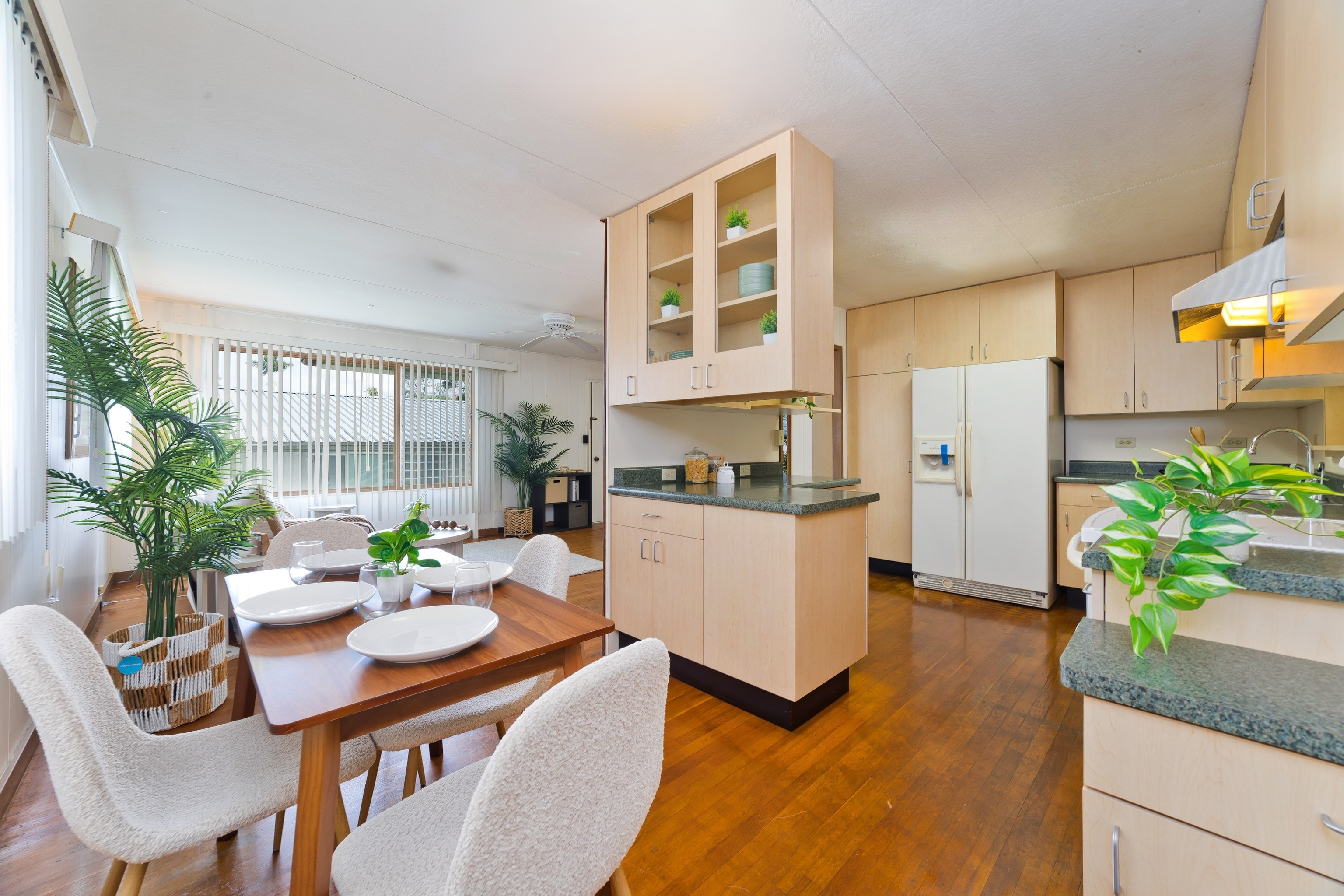 25 Wawai Loop Hilo, HI 96720 - Photo 5 of 22 a kitchen with a table and chairs in it