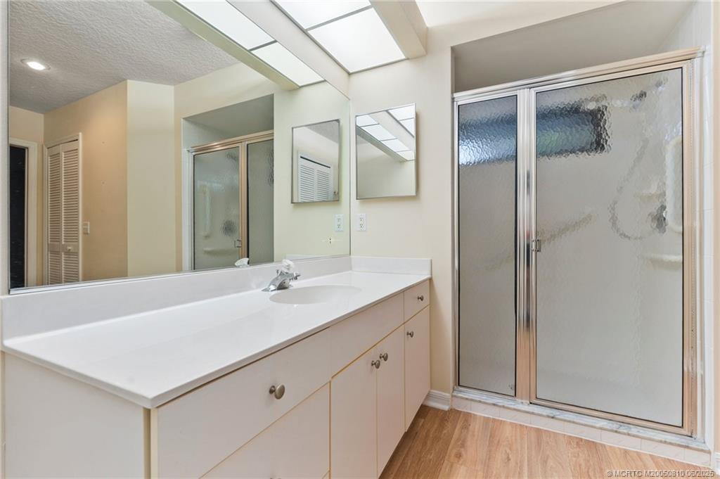542 Woods Edge Trail Stuart, FL 34997 - Photo 23 of 31 a bathroom with a sink and a mirror