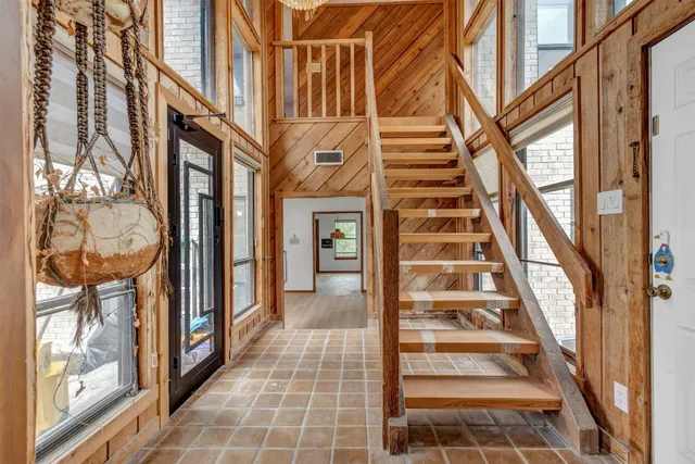 a view of a large building with a large window and front door