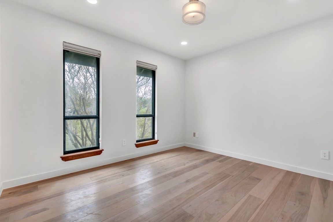1201 County Road 138 Hutto, TX 78634 - Photo 18 of 26 an empty room with windows and closet