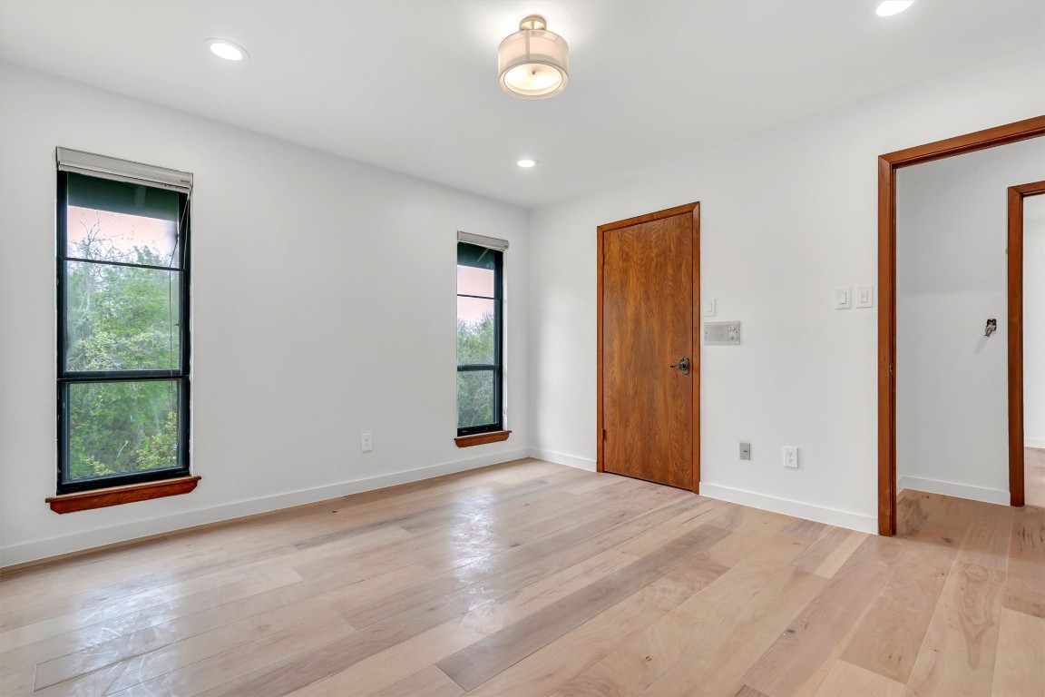 1201 County Road 138 Hutto, TX 78634 - Photo 21 of 26 an empty room with windows and closet