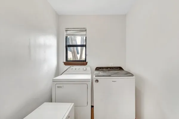 a utility room with dryer and washer