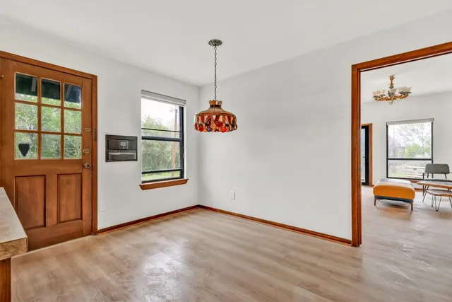 a view of an entryway with wooden floor