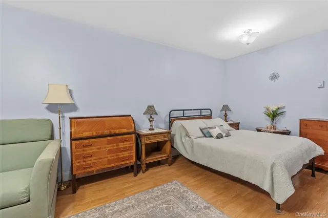 a bedroom with a bed and a lamp