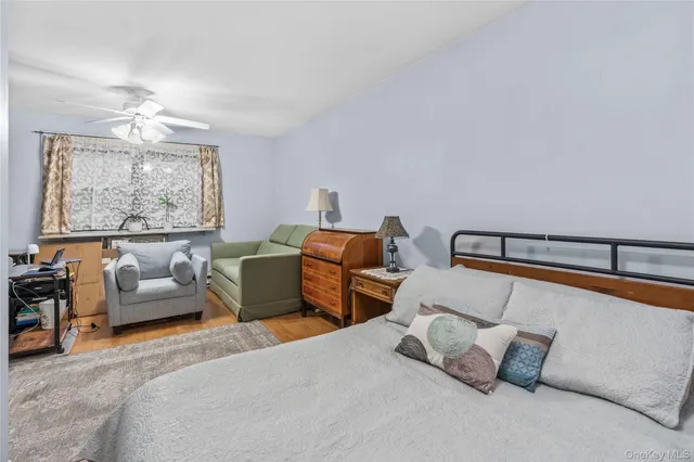 a bedroom with furniture and a chandelier