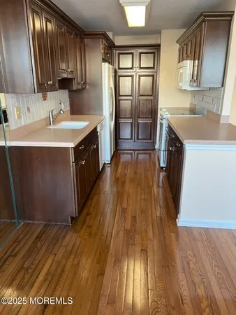 a spacious bathroom with a sink and a mirror