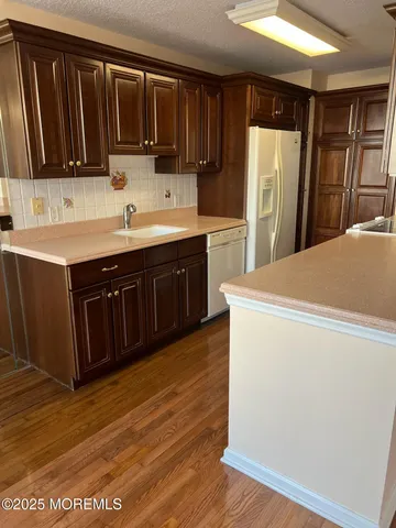 a kitchen with stainless steel appliances a refrigerator and a sink
