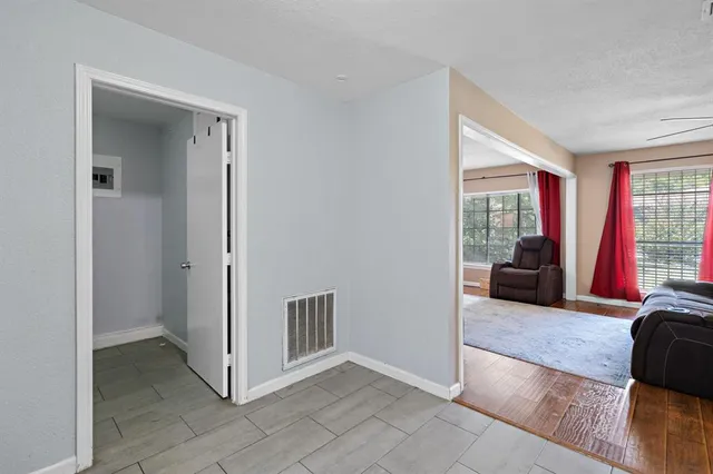 a view of a livingroom with furniture and an entryway