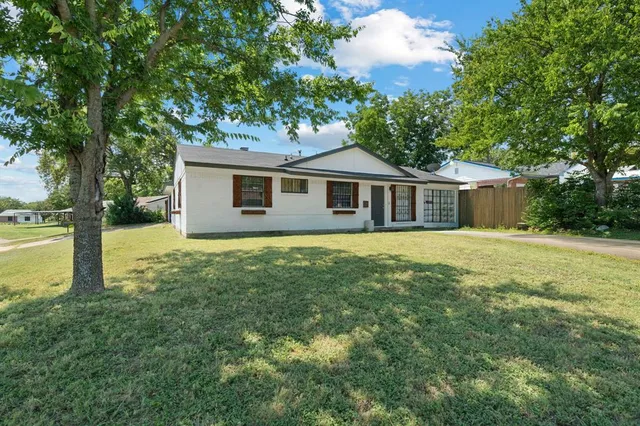 a house with trees in the background