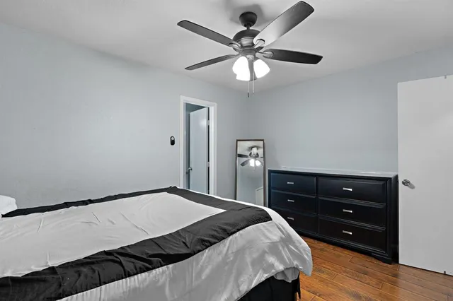 a bedroom with a bed and a dresser