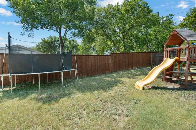 a view of a backyard with a slide