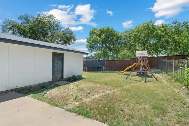 a view of backyard with slide