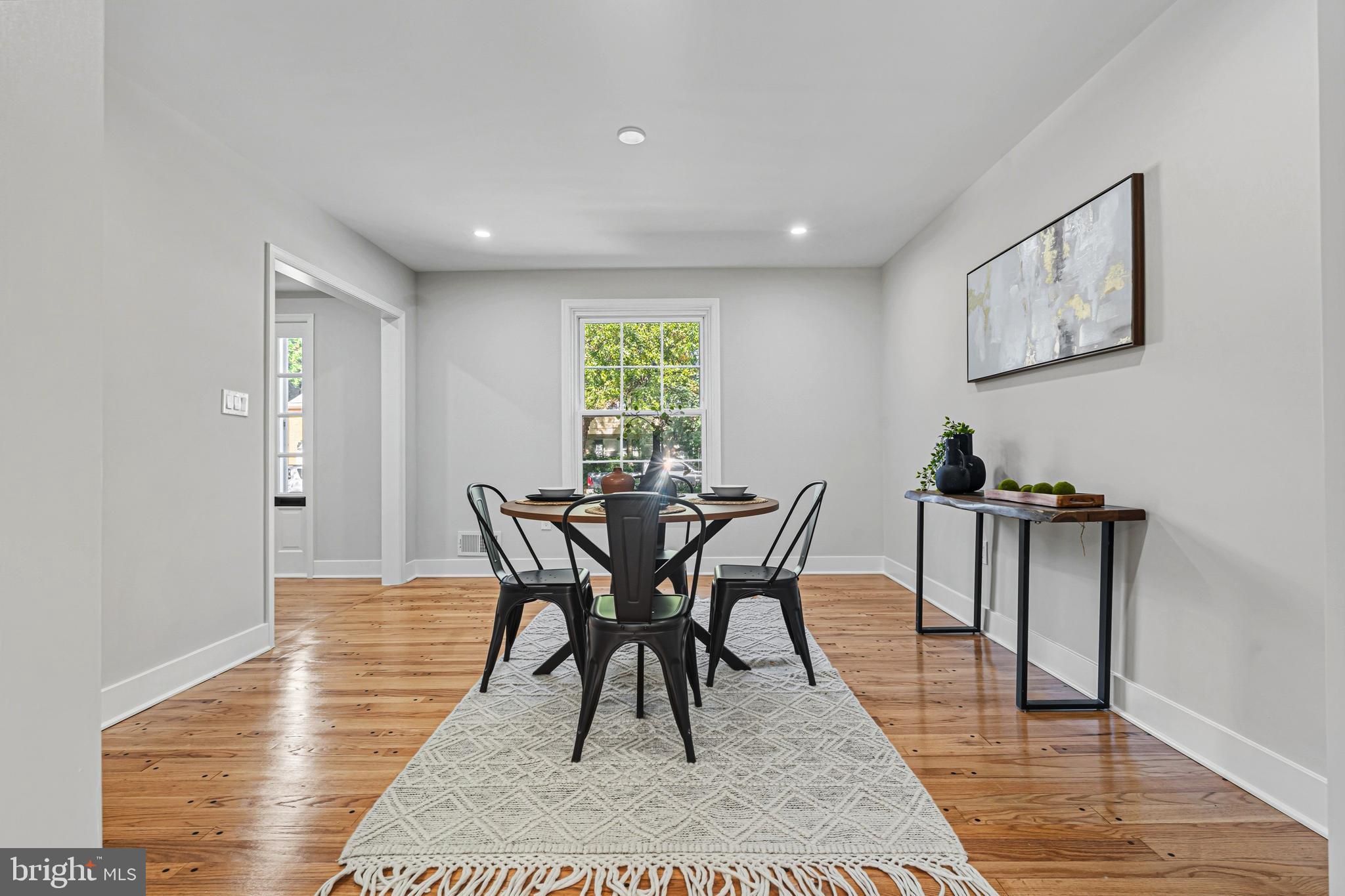 803 Stoneleigh Road Baltimore, MD 21212 - Photo 14 of 56 a view of a dining room with furniture and wooden floor