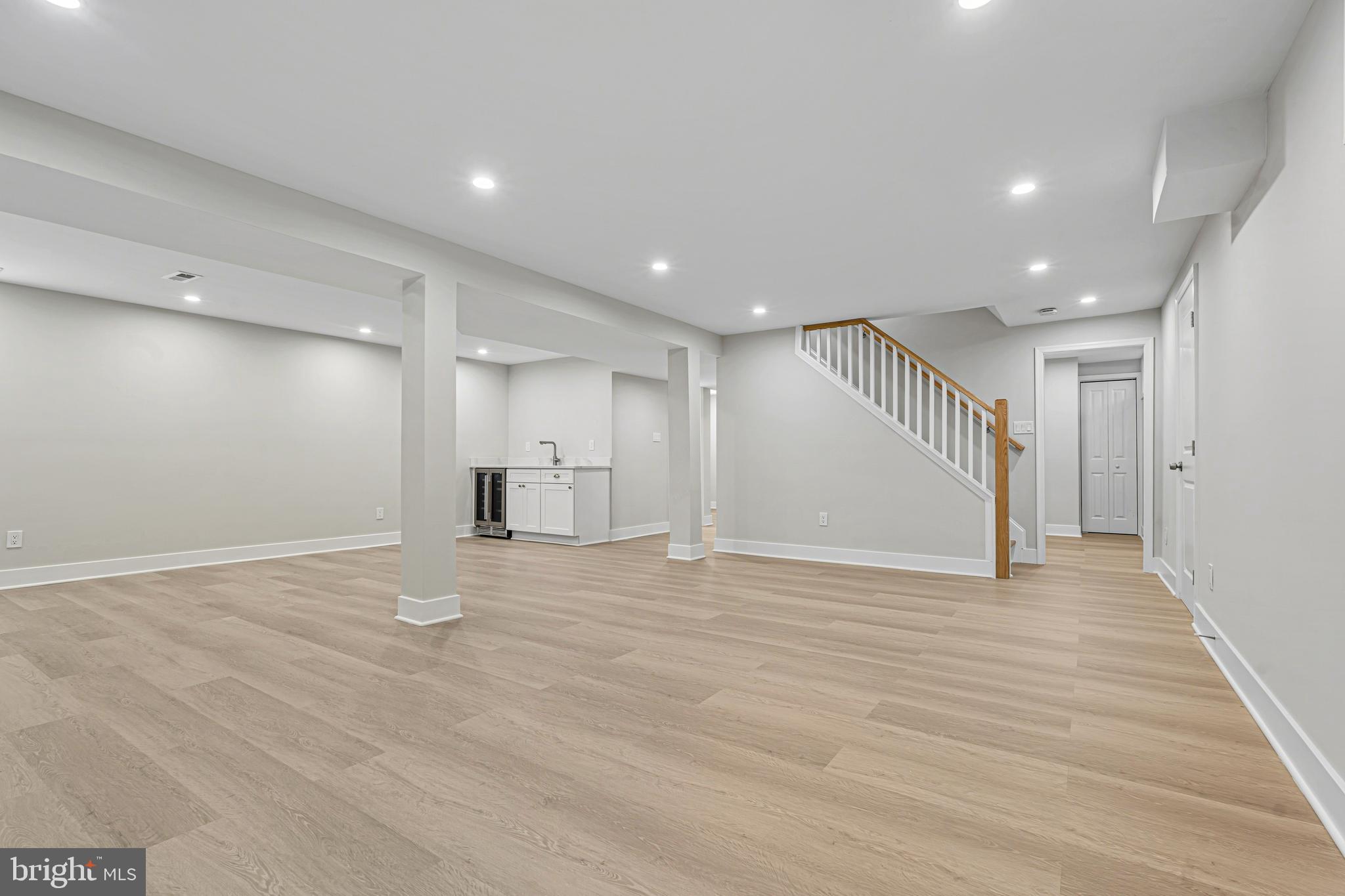 803 Stoneleigh Road Baltimore, MD 21212 - Photo 44 of 56 a view of an empty room with wooden floor