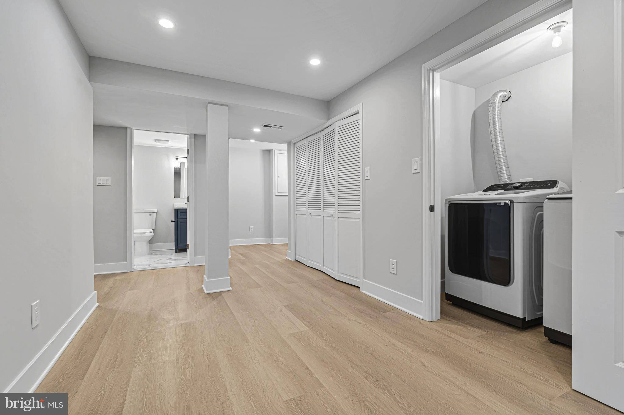 803 Stoneleigh Road Baltimore, MD 21212 - Photo 47 of 56 a view of a hallway with wooden floor and staircase