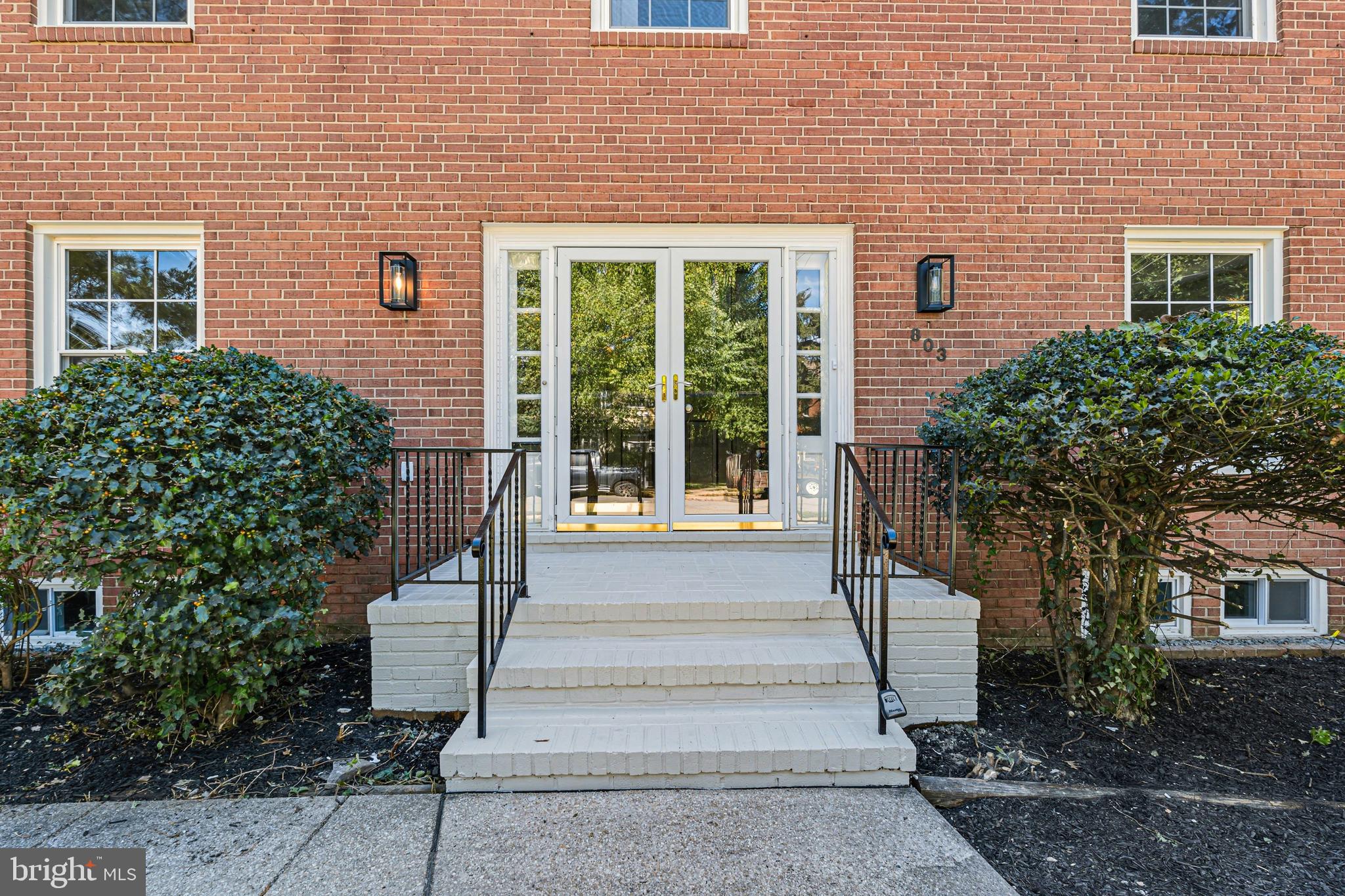803 Stoneleigh Road Baltimore, MD 21212 - Photo 7 of 56 a front view of a house with a garden