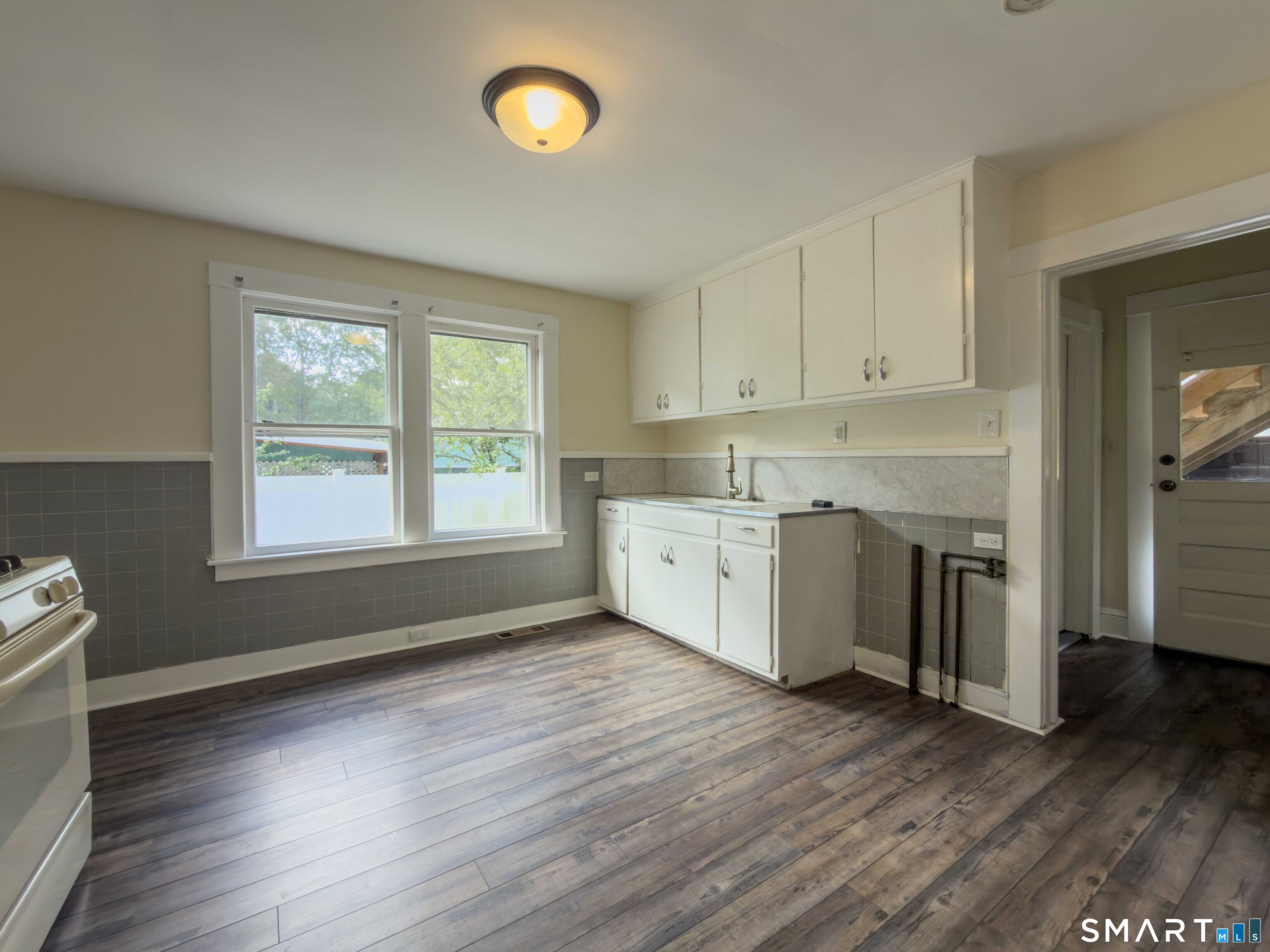72 Roosevelt Avenue Norwich, CT 06360 - Photo 8 of 24 Eat-in kitchen with washer hook up.