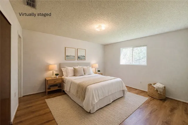 a bedroom with a bed and window