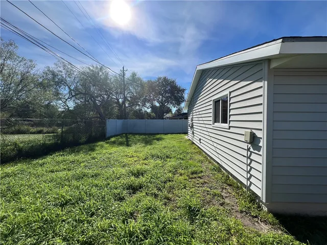 a backyard of a house with lots of green space