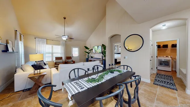 a very nice looking dining room with a table and chairs