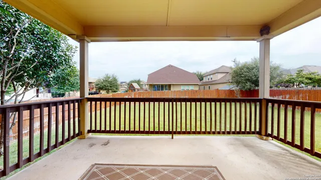 a view of a two chairs in the balcony