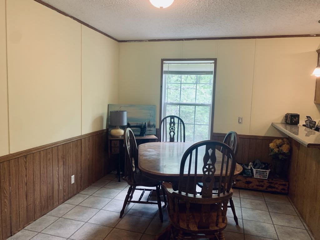 8603 Crawley Hill Rd Mount Mount Pleasant, TN 38474 - Photo 5 of 12 a view of a dining room with furniture and window