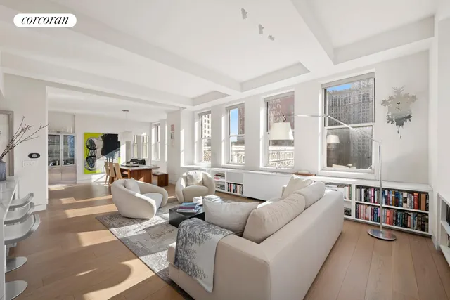 a kitchen with stainless steel appliances a stove a sink cabinets and a refrigerator