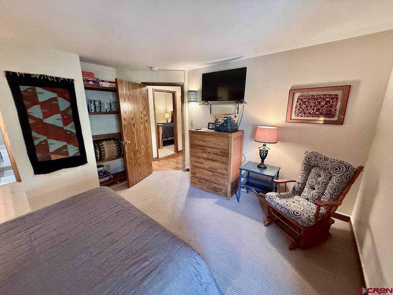 11 Snowmass Road, Unit 337 Crested Butte, CO 81225 - Photo 24 of 35 a living room with furniture and a flat screen tv