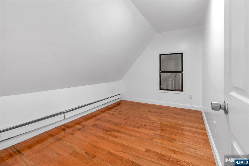 25 Oak Street Paterson, NJ 07501 - Photo 14 of 25 a view of an empty room and window