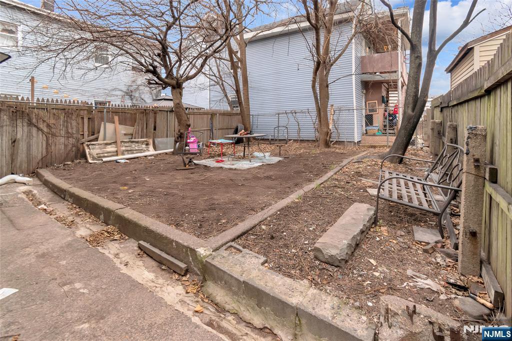 25 Oak Street Paterson, NJ 07501 - Photo 24 of 25 a view of a yard with brick house