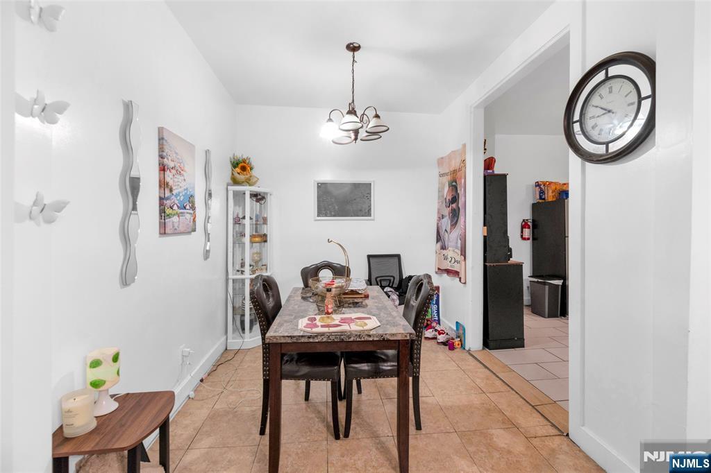 25 Oak Street Paterson, NJ 07501 - Photo 5 of 25 a view of a dining room with furniture and a chandelier