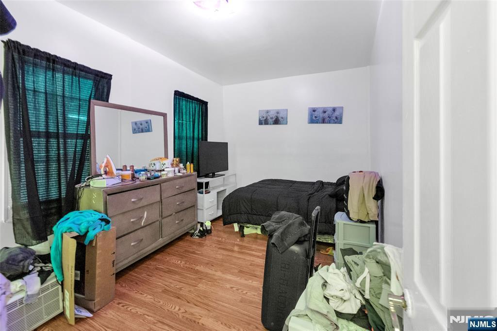 25 Oak Street Paterson, NJ 07501 - Photo 8 of 25 a living room with furniture and wooden floor
