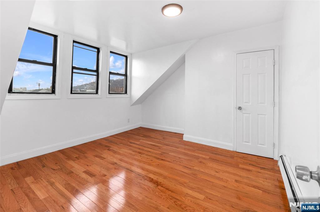 25 Oak Street Paterson, NJ 07501 - Photo 9 of 25 a view of empty room with window