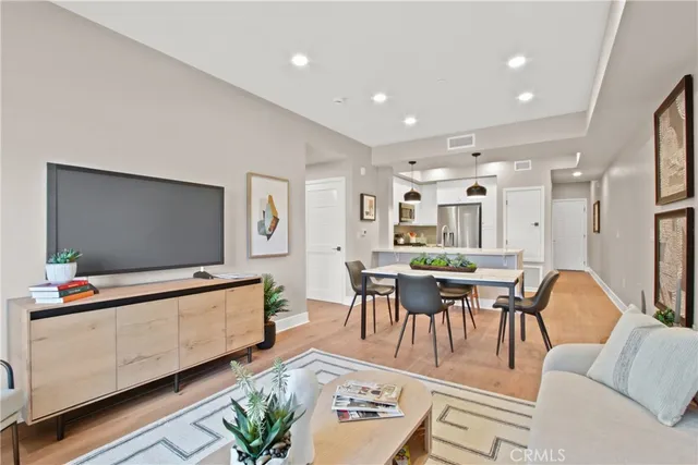 a dining room with furniture and wooden floor