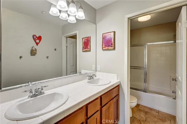 a bathroom with a sink a vanity and a mirror