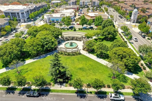 an aerial view of a residential houses with yard and swimming pool