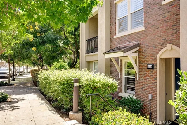 front view of a brick house with a large windows