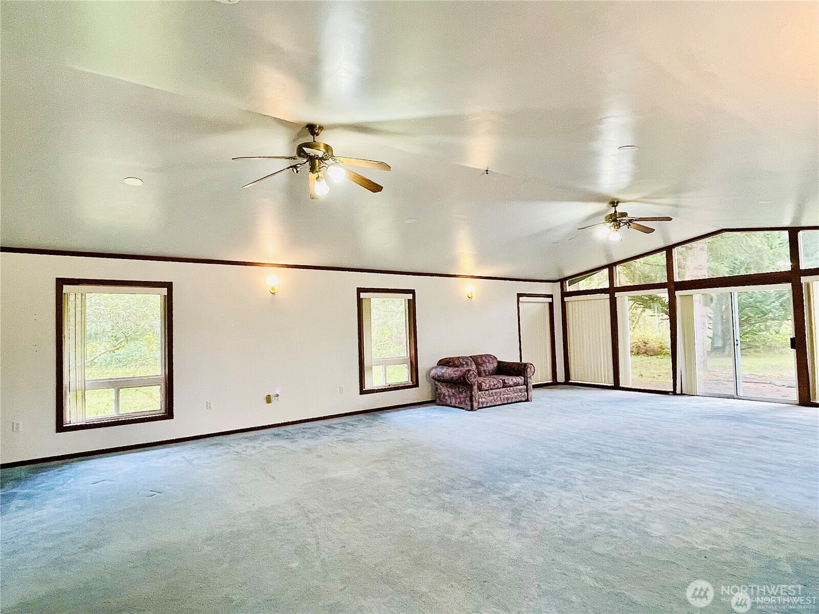 15407 264th Street East Graham, WA 98338 - Photo 6 of 23 an empty room with windows and fan