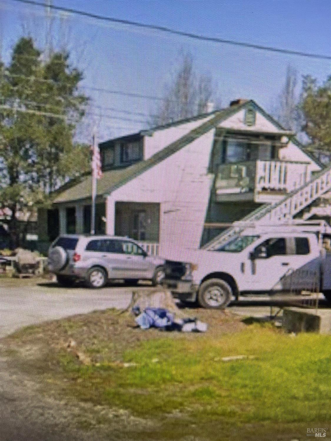 a view of a house with swimming pool and furniture