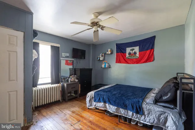 a bedroom with bed and window